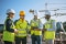 Construction team discussing site requirements including managing environmental challenges.