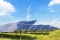 Solar and wind installation generating renewable energy under managed conditions.