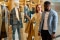 Shoppers browsing a fashion retail window display