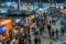 Crowded trade show floor with multiple exhibition booths requires effective climate control.