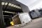 Temporary HVAC units positioned outside a production facility.