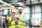 Petrochemical engineers assessing the need for temporary cooling and heating at an industrial site