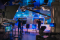 Behind-the-scenes view of a studio production with cameras and lighting rigs
